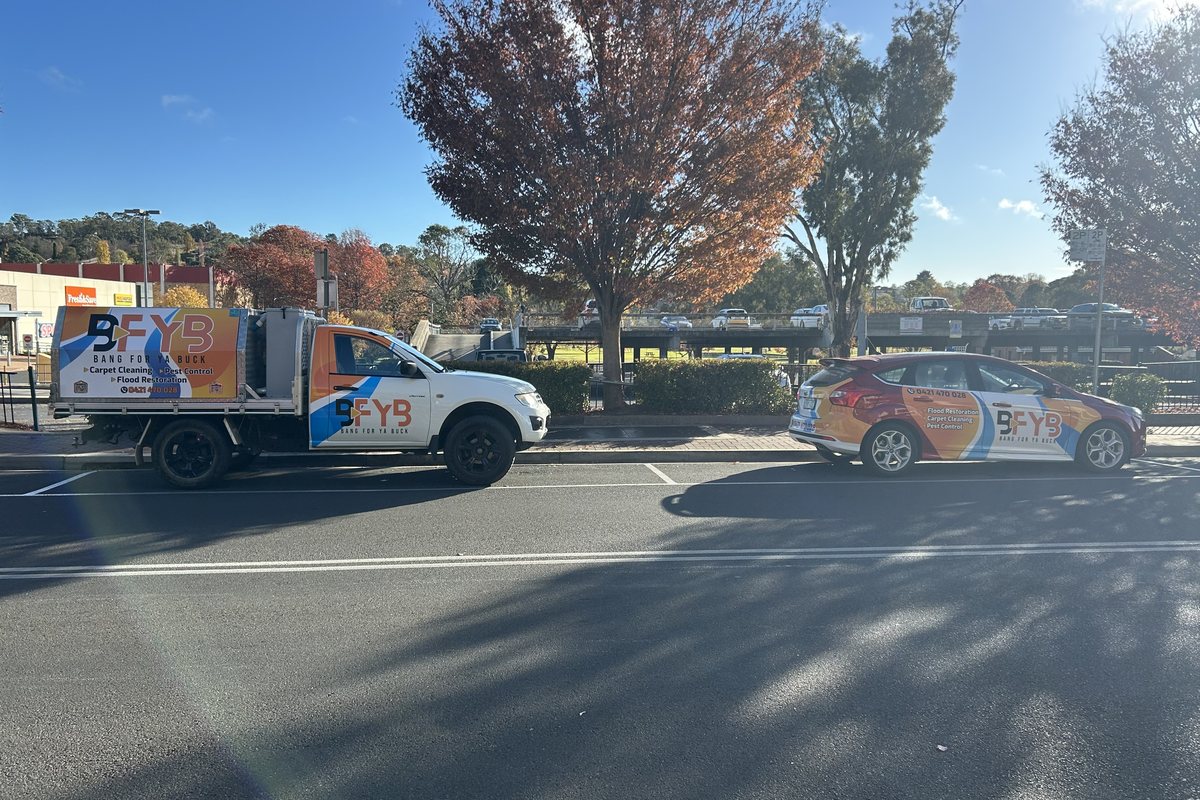 BFYB service vehicles on a street in the New England